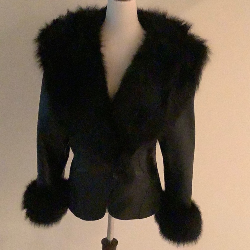 Lace -Up- Back Leather jacket. Could fit size Small, Medium or Large.